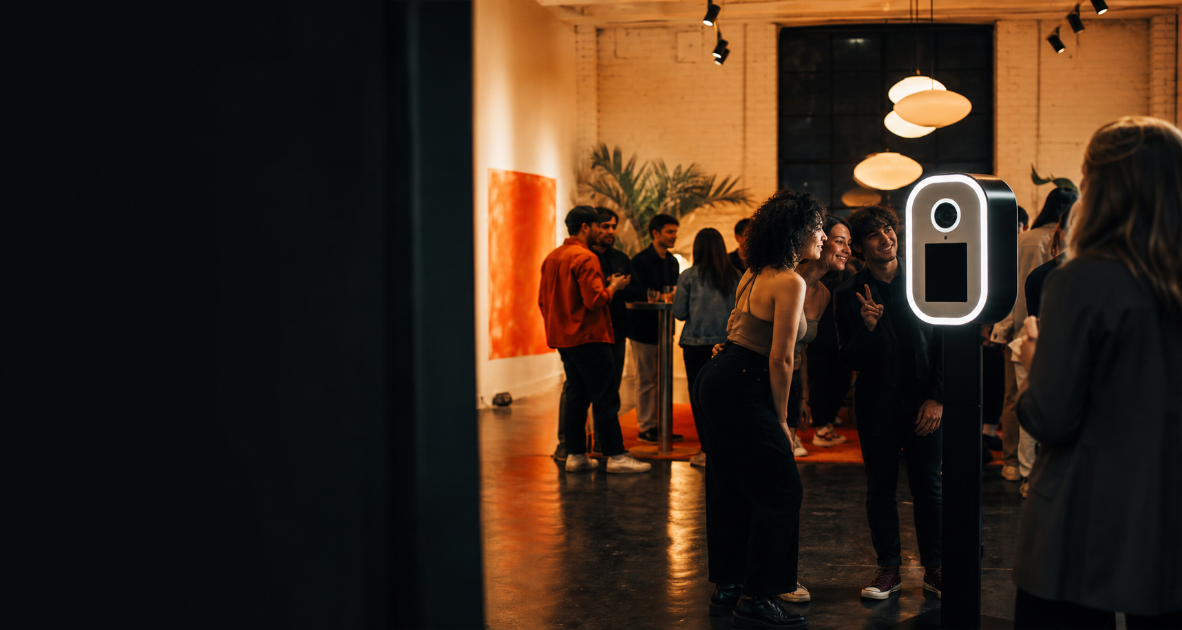 Guests posing at a One Yard photobooth